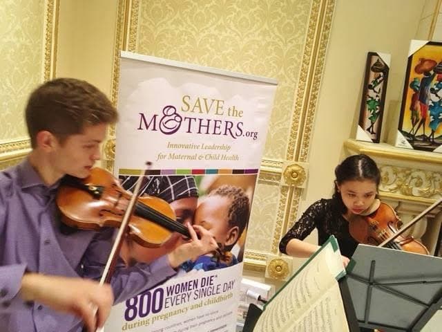 Matthew and Yen Eeuwes performing at a Save the Mothers benefit concert